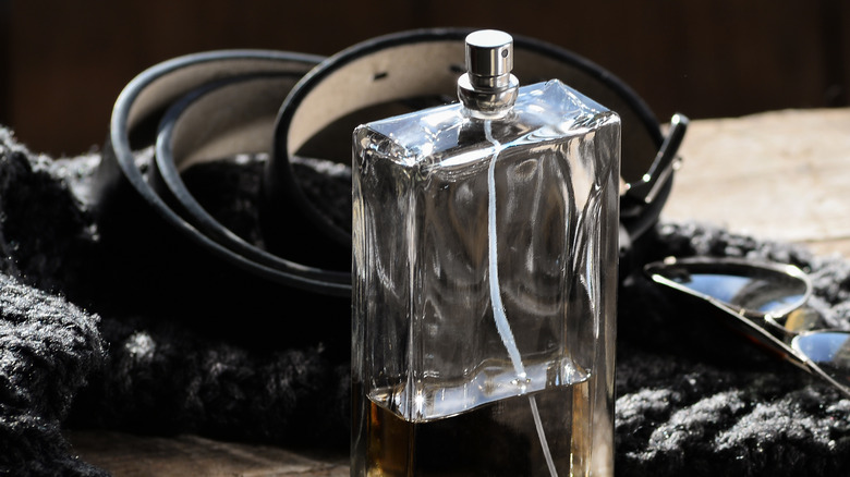 fragrance bottle scarf and leather belt