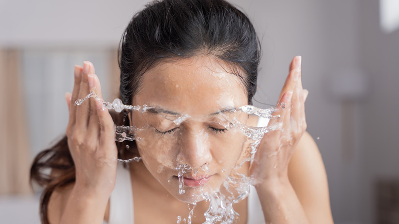 woman washing face