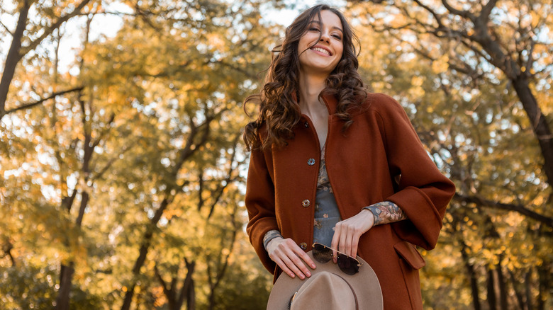 Smiling woman in autumn