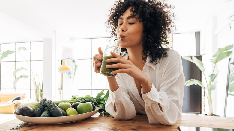 woman drinking smoothie