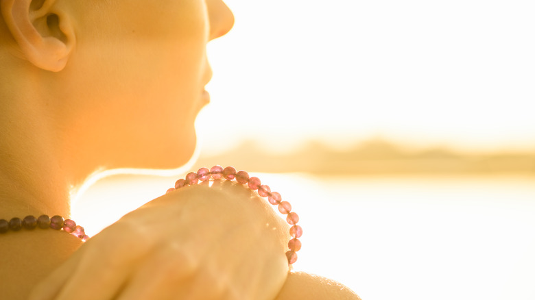 person outside wearing bracelets