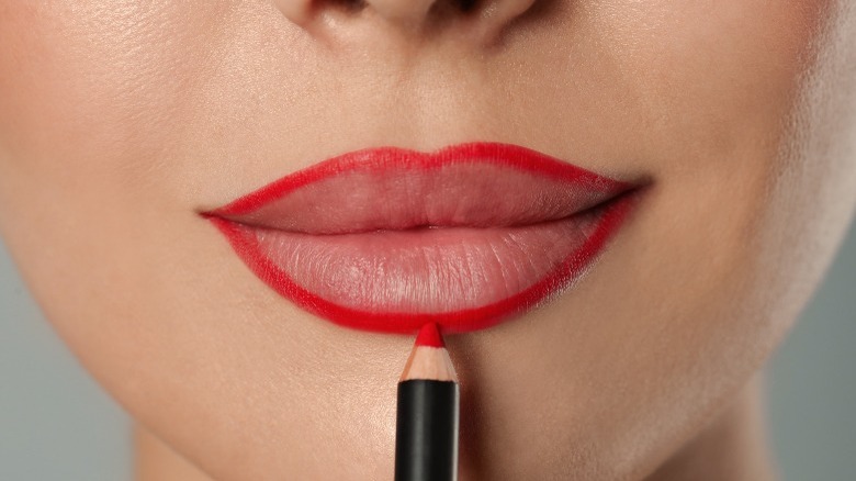 Lips with red lip liner