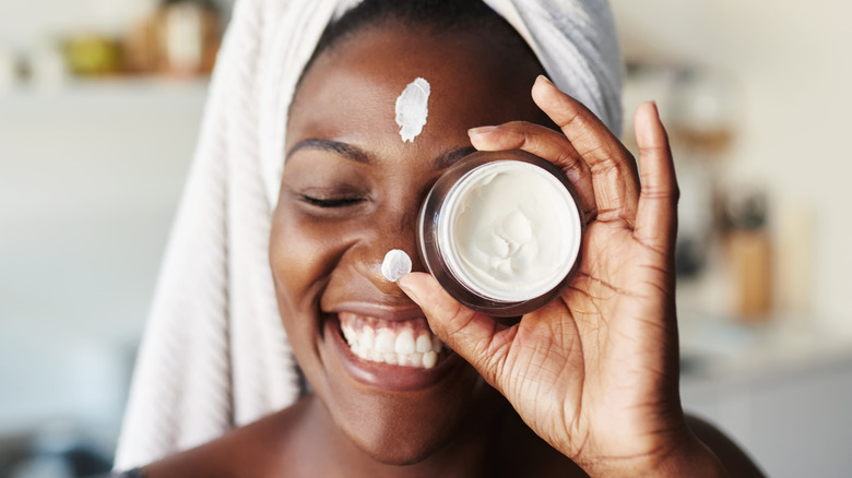 woman wearing skin cream