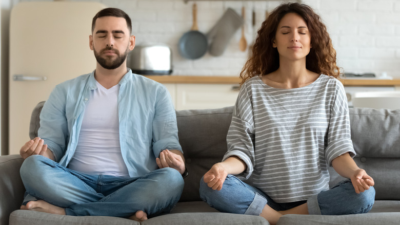 Couple finding balance through meditation