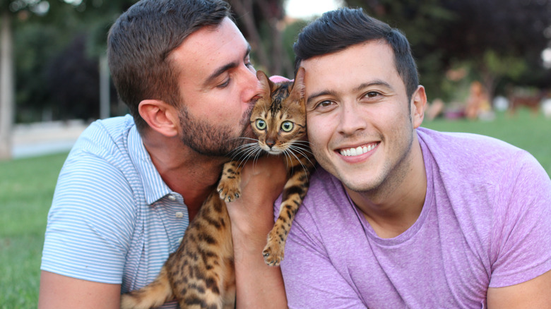 Happy couple with a cat