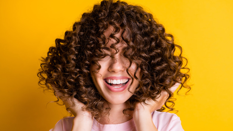 Smiling woman with curly hair