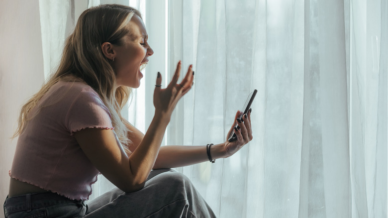 Woman screaming at phone