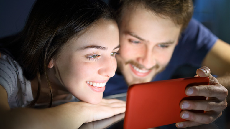 couple looking at the phone