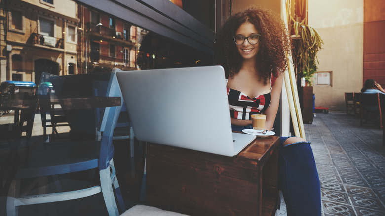 Woman working at café