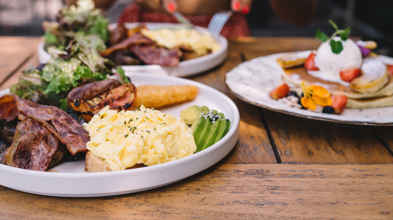 women eating egg dishes