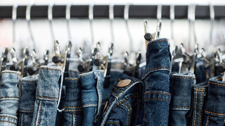 Denim jeans on a clothing rack