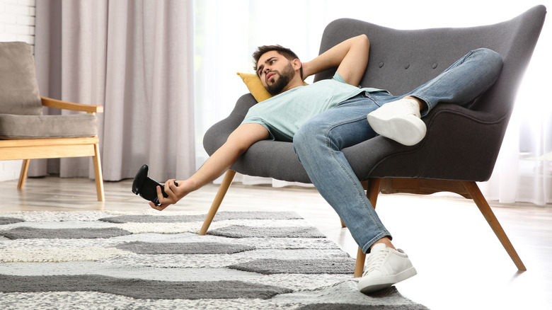 lazy man laying on couch