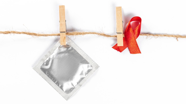 Condom and AIDS awareness ribbon