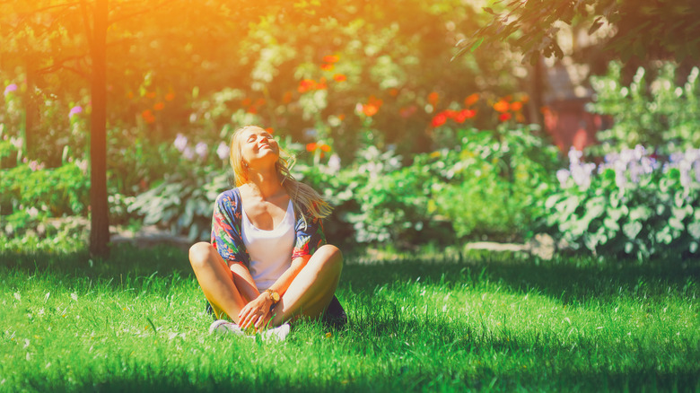 Woman sitting in sun