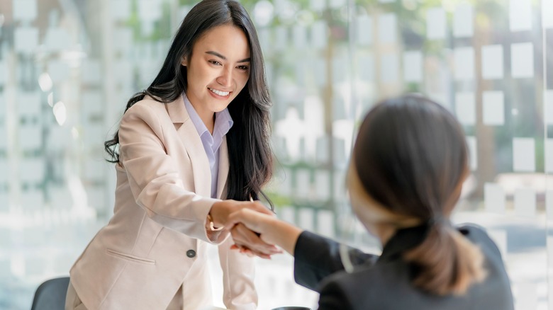 Woman shaking hands with someone