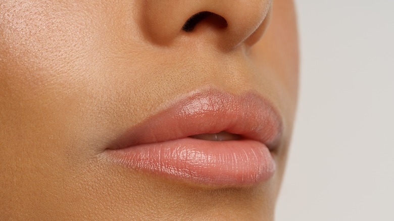 Woman showing the results of a lip flip