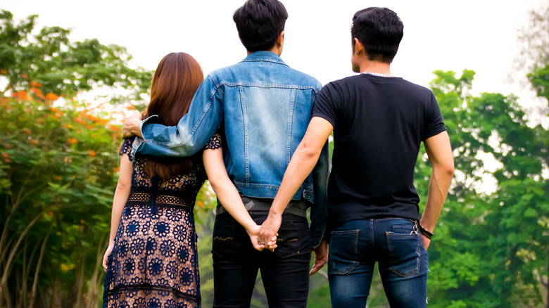 three people standing together