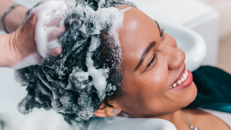 female having a hair wash at a hair salon