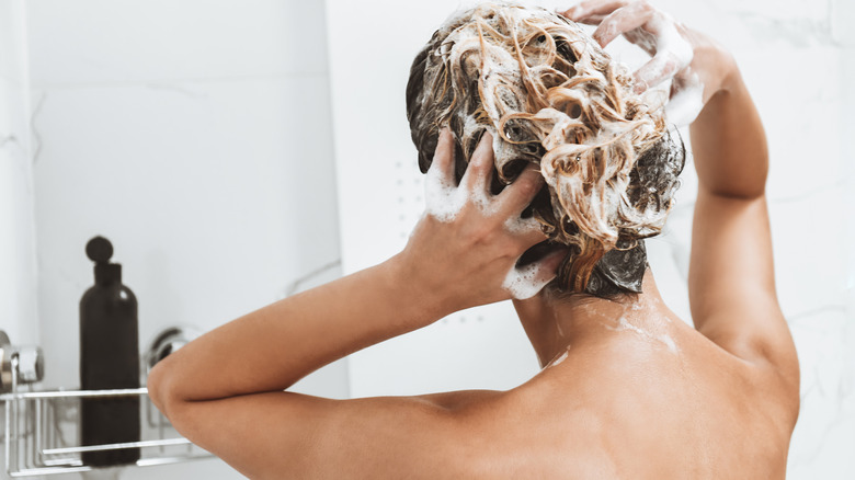 Woman shampooing her hair 