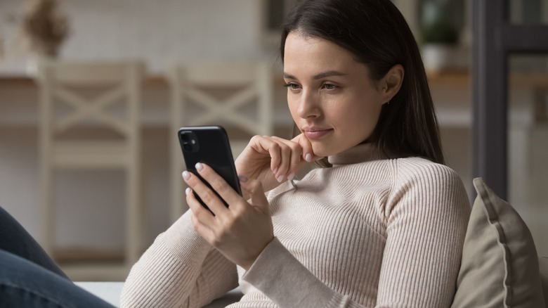 thinking woman on a phone