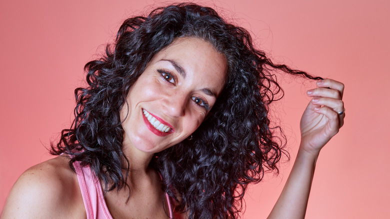 Woman showing off her healthy curls.