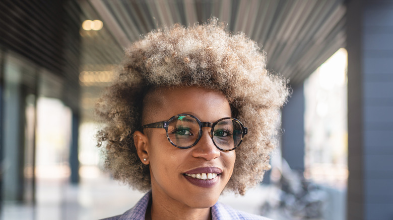 Woman with curly hair undercut