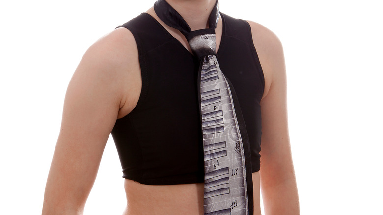 Trans person wearing chest binder