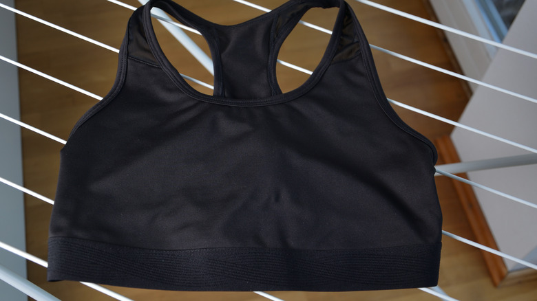 black sports bra on laundry rack