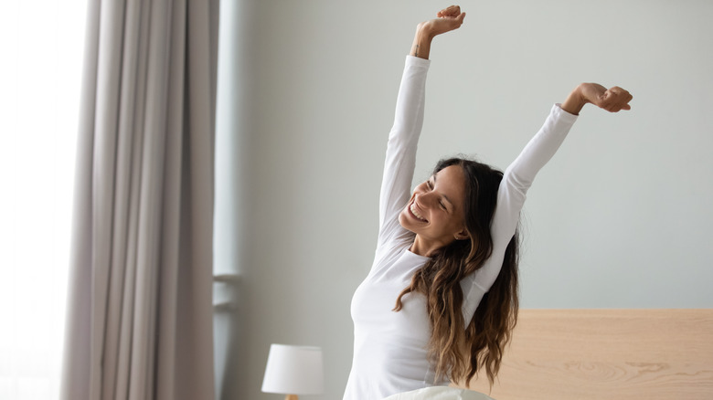 woman stretching in morning