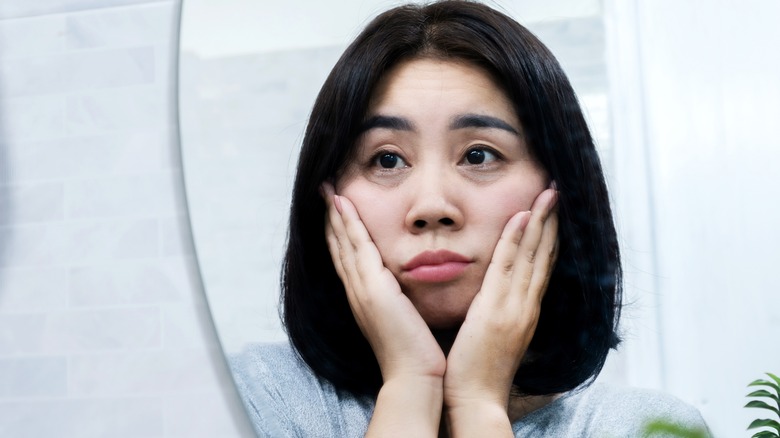 Woman looking at puffy face