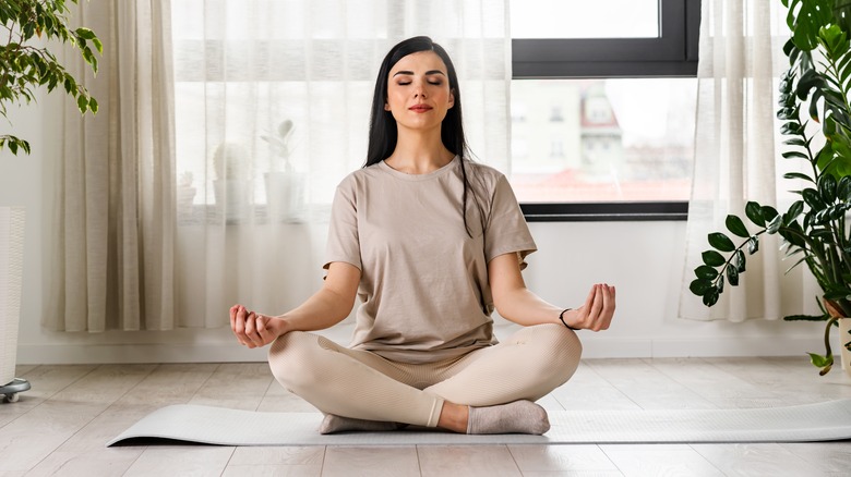 Woman doing yoga at home