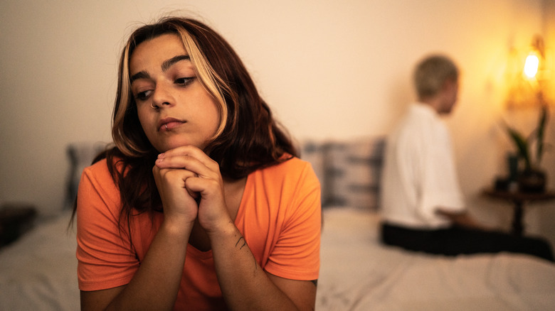 unhappy couple on bed