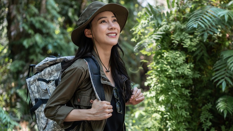 Positive woman hiking