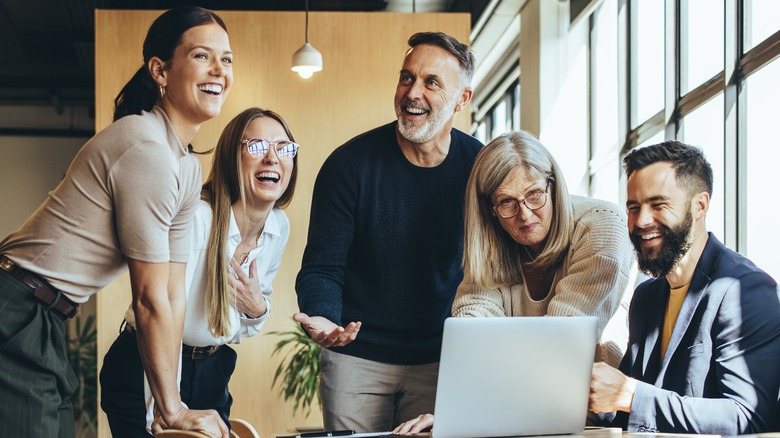 Positive coworkers laughing