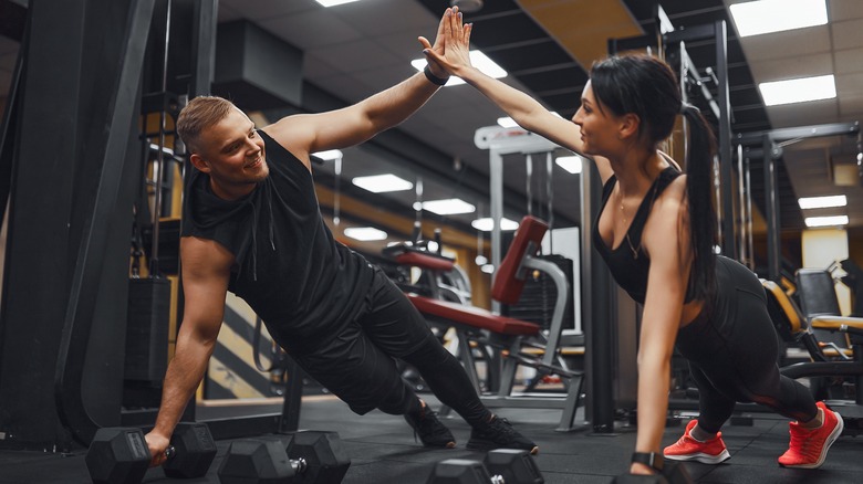 Gym couple exercising