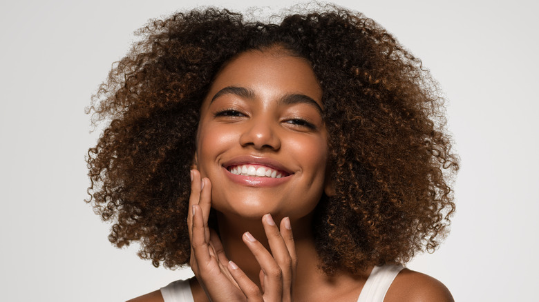 Smiling woman with glowing skin