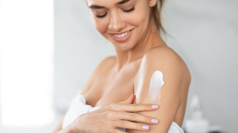 Woman applying skincare serum