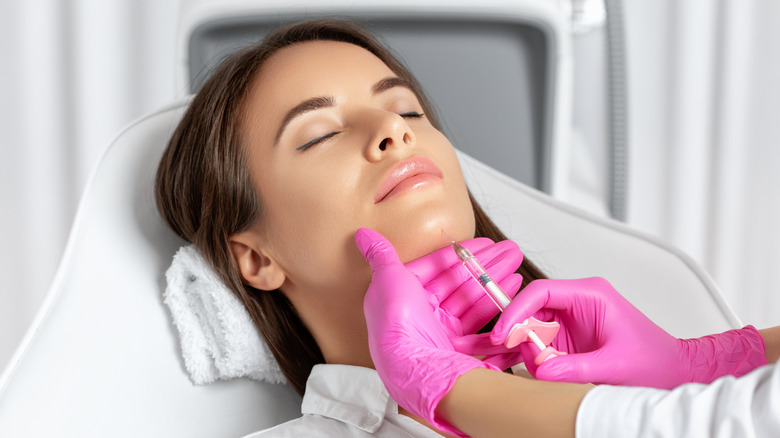 woman chin filler injection