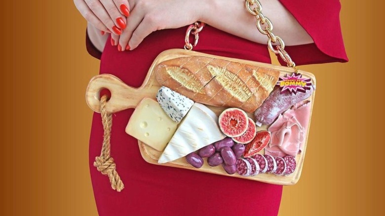 Woman with charcuterie board handbag