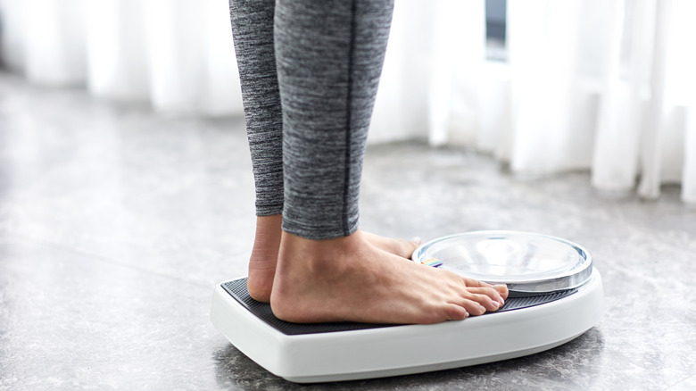 woman weighing herself 