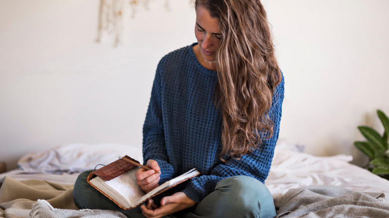 woman writing journal