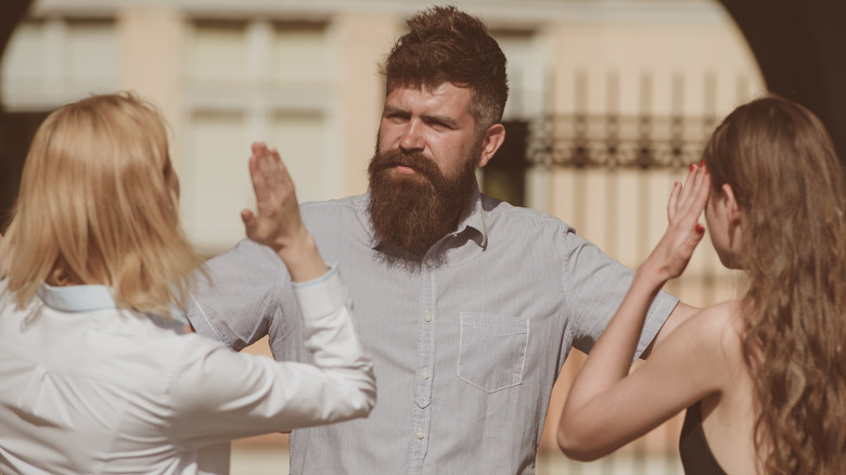 three people arguing