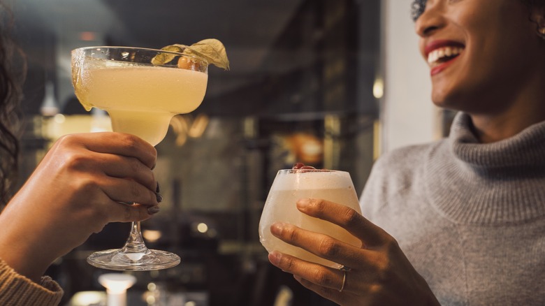 women drinking cocktails