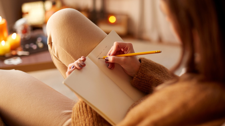 Woman writing in a journal