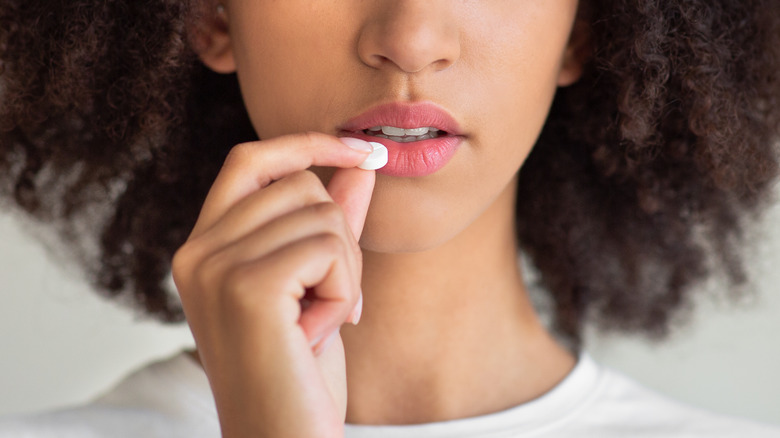 woman taking meds