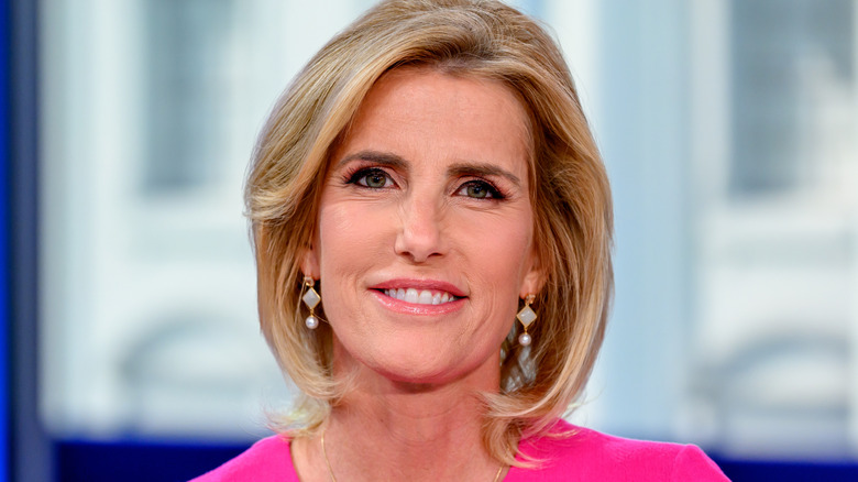 Laura Ingraham posing on the set of her TV  show, "The Ingraham Angle."