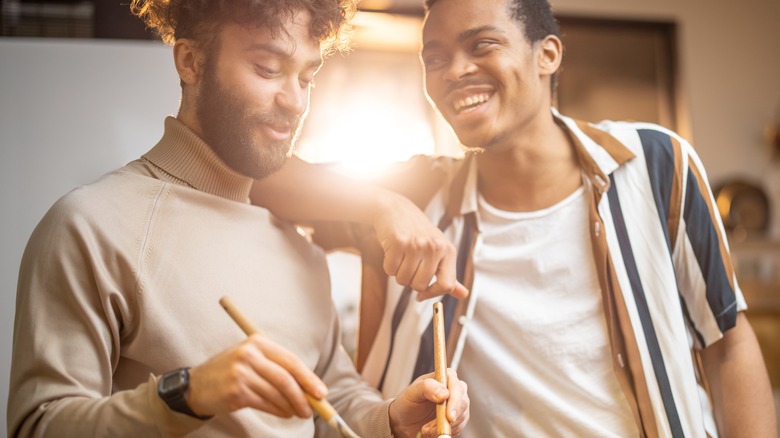 smiling couple making dinner