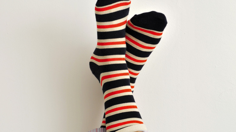 striped socks on person's feet