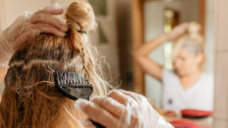 woman dying her hair at home