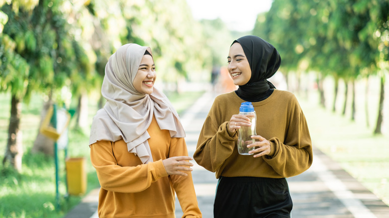 two woman walking